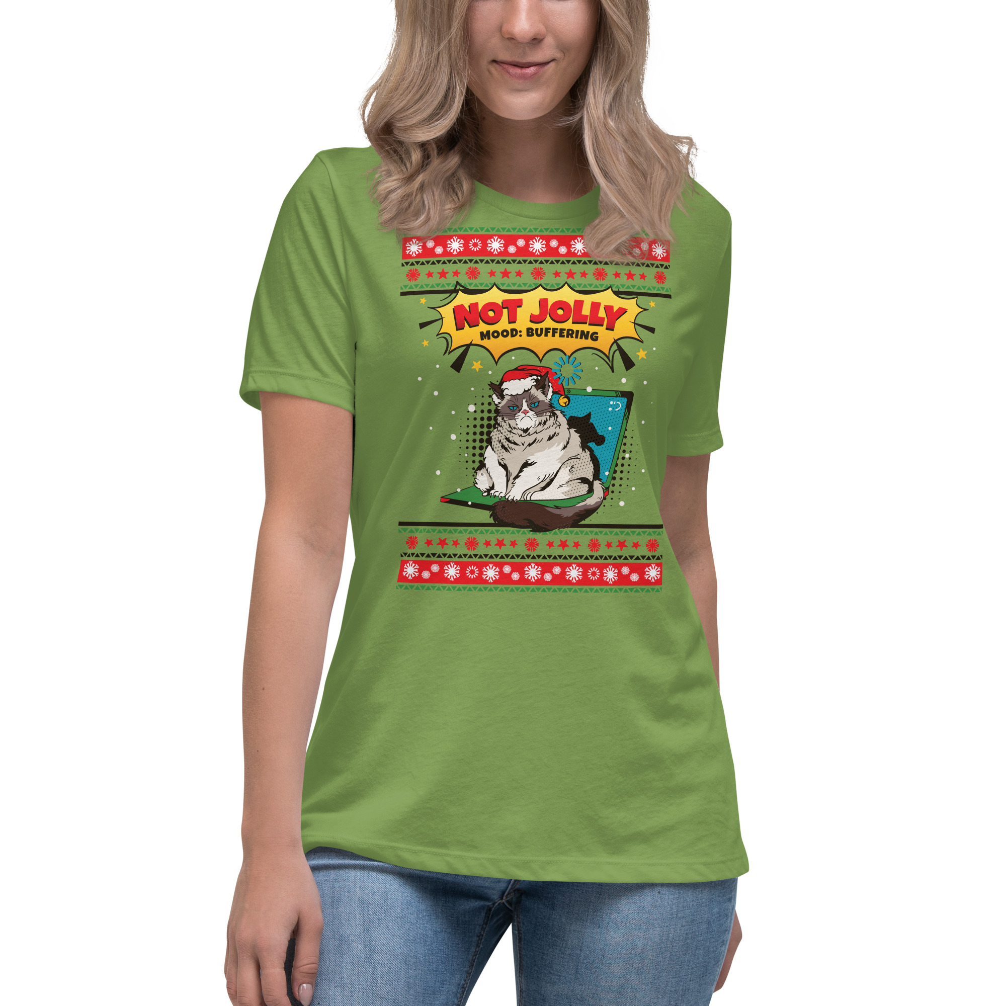 A woman rocks a green tee with a scowling cat in a Santa hat, showered in snowflakes—caption: “Not Jolly, Mood: Buffering.”.