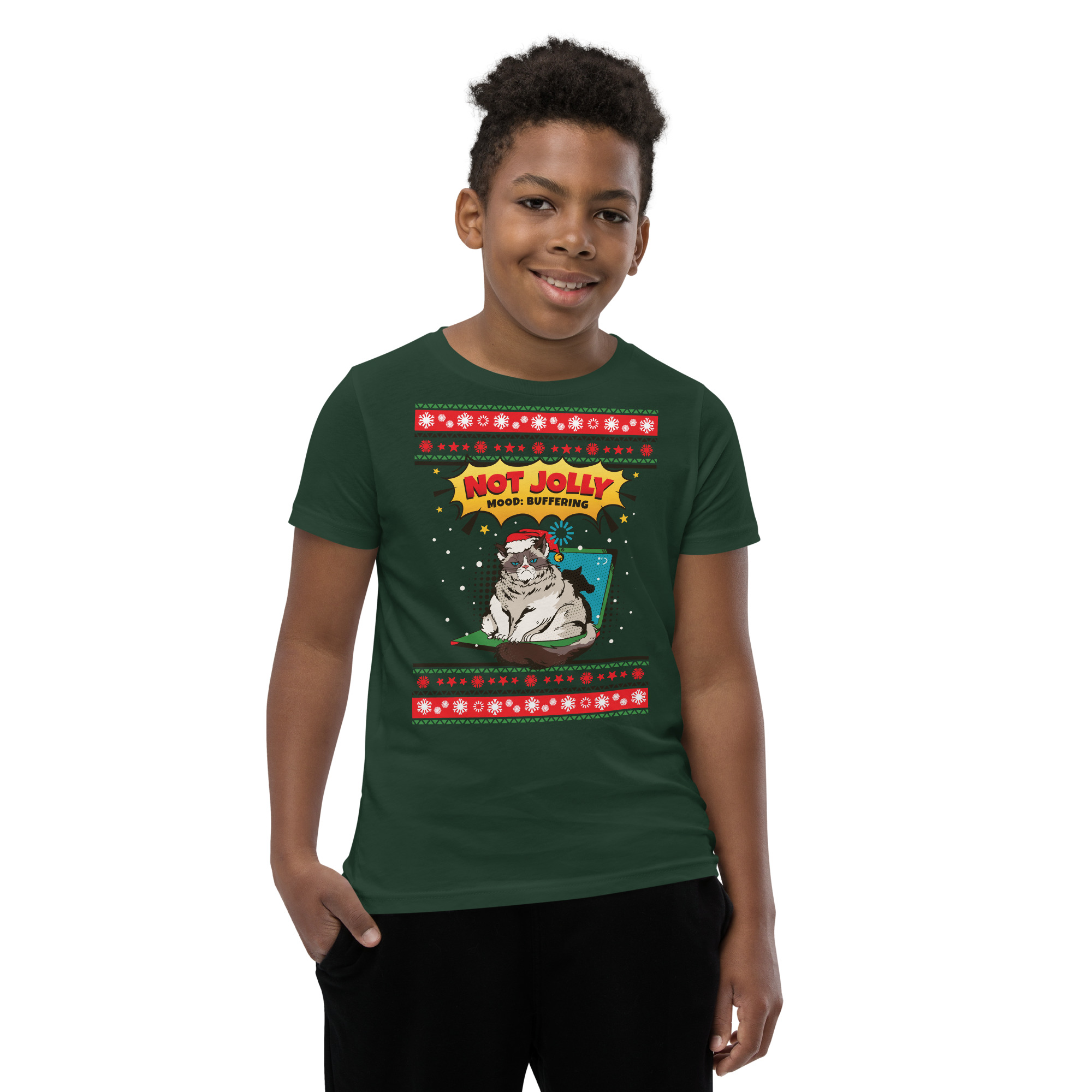 A grinning kid rocks a forest-green tee decked with a cranky cat, wild red-white swag, and “Not Jolly, Not Buttered.” Festive chaos!.