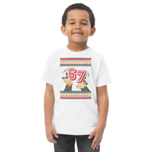 A grinning kid rocks a white tee exploding with the number 67, rainbow dots, ASL hand signs, and stripes—party starter alert!.