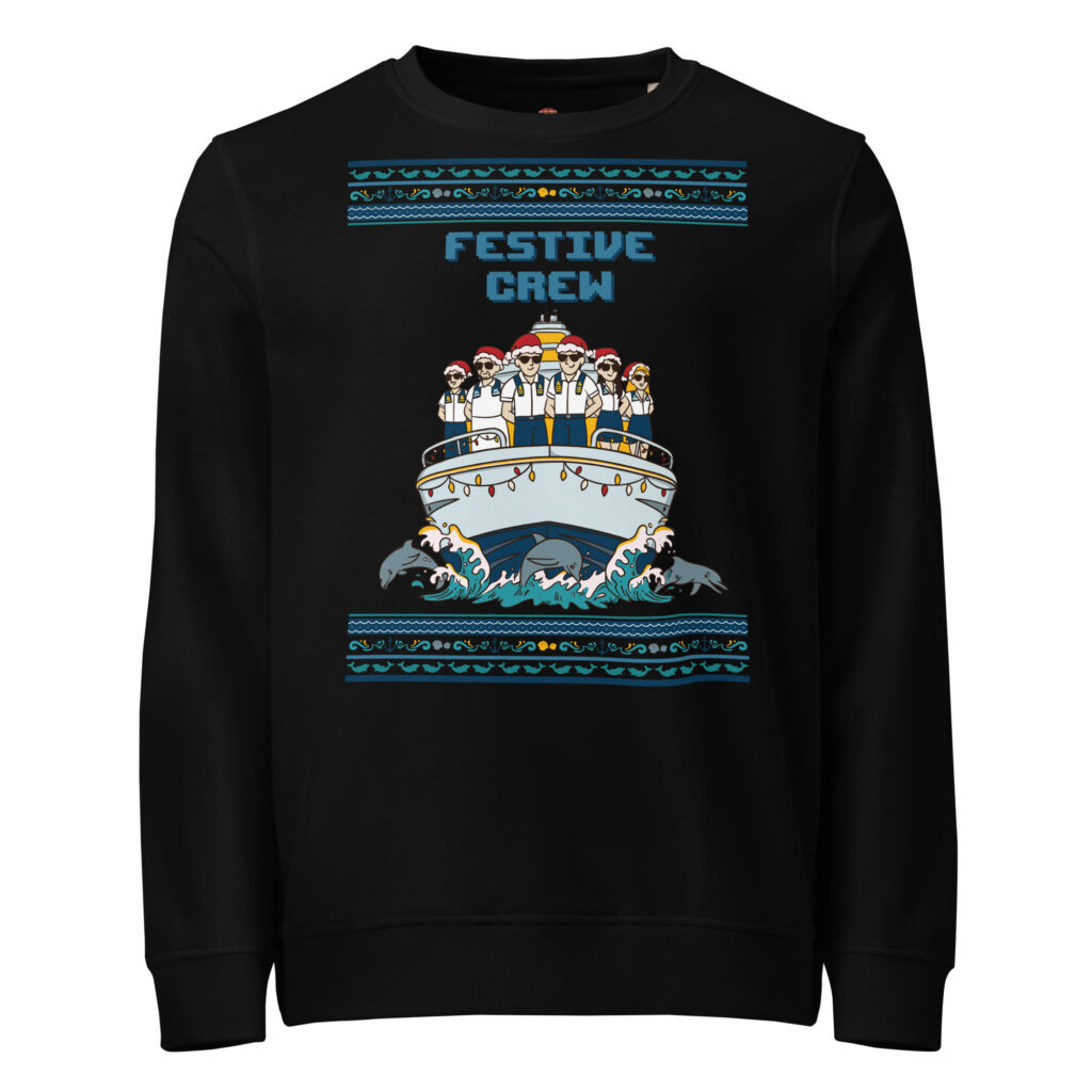 Brace yourself: black unisex sweatshirt with a cartoon crew in goofy holiday hats, wild borders, and dolphins throwing a wave party.