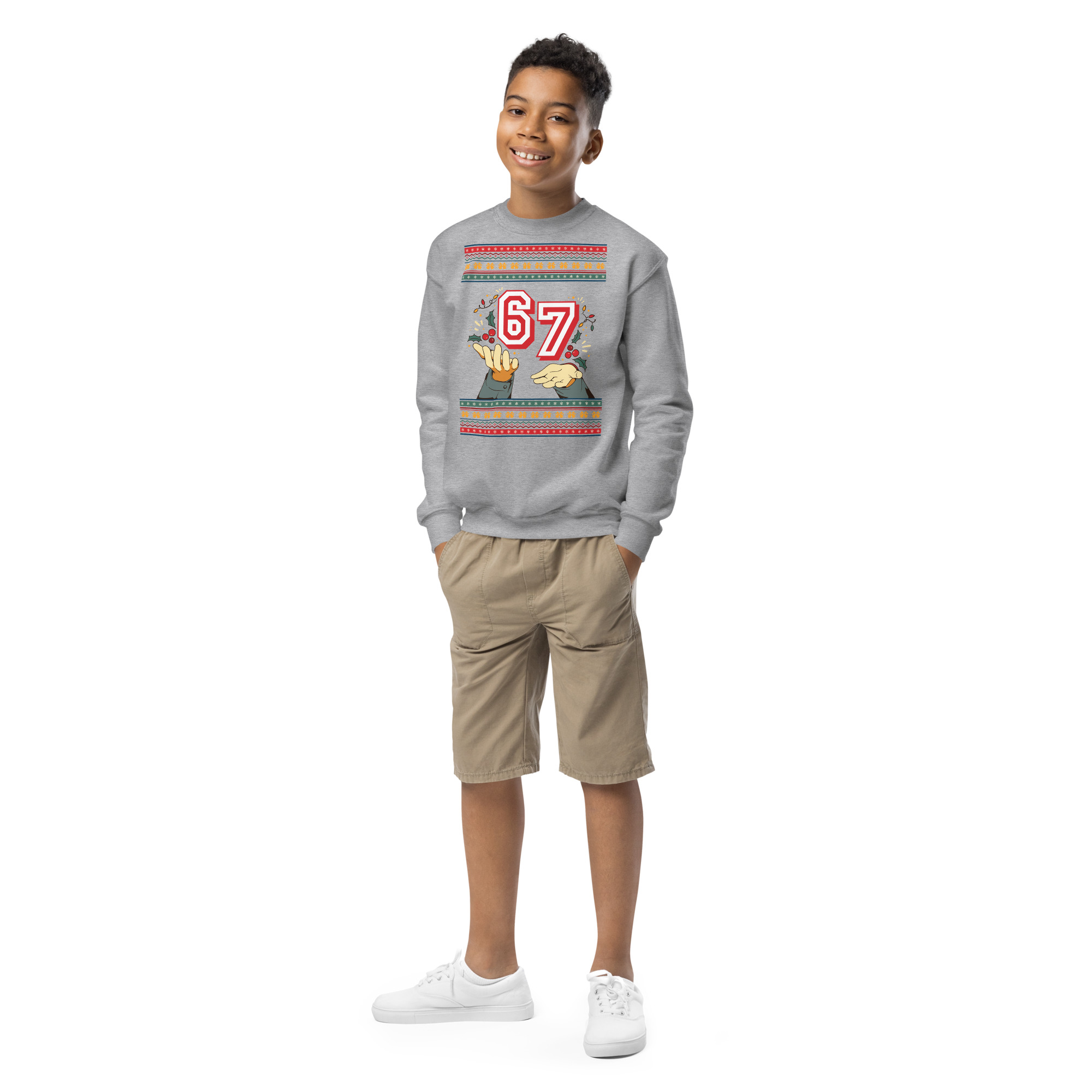 Look out, fashion world! This grinning kid rocks a super chill grey sweatshirt, beige shorts, and sneakers on a blank canvas runway.