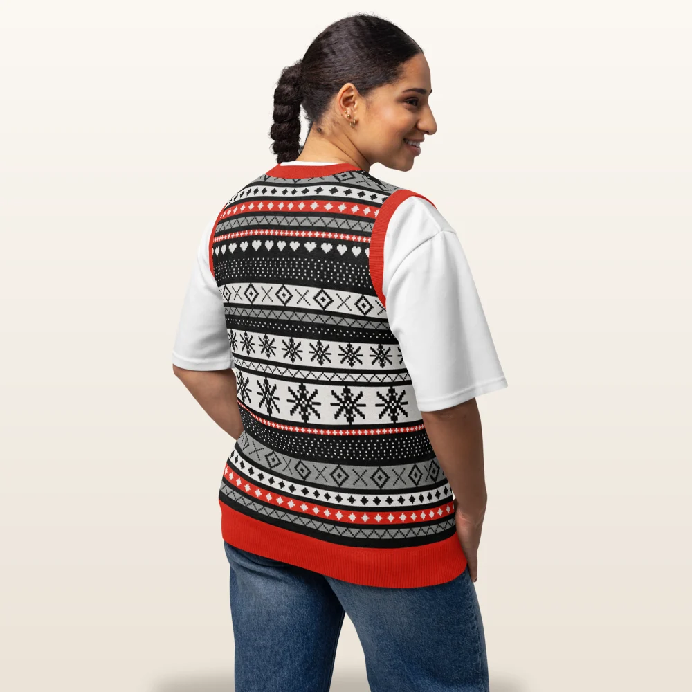 Woman wearing the Selbu Bird knitted Christmas vest, back view with the star medallion band